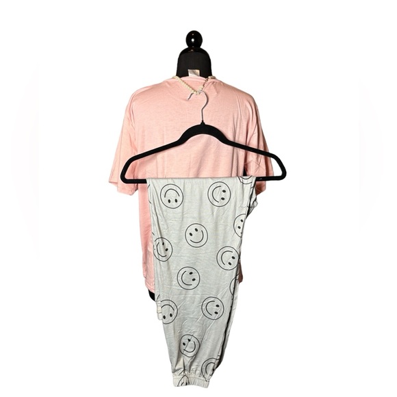 Sold Pink pajamas with peace and happy signs. New. 21” ptp 26” shoulder to hem - Picture 2 of 3